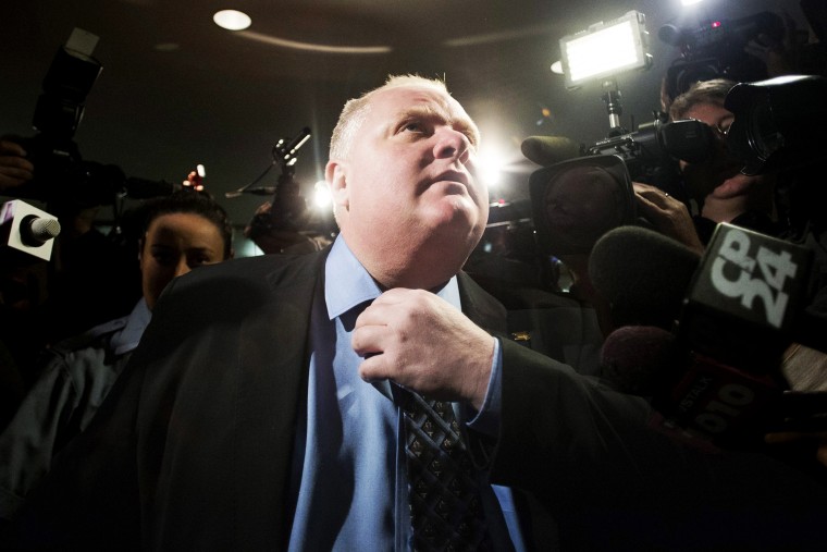 Toronto Mayor Rob Ford makes his way to the council chamber in Toronto on Friday, Nov. 15, 2013.