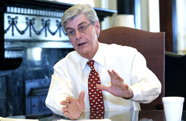 Mississippi Gov. Phil Bryant speaks during an exclusive pre-legislative session interview with The Associated Press at his office in the Capitol in Jackson, Mississippi, December 18, 2013.