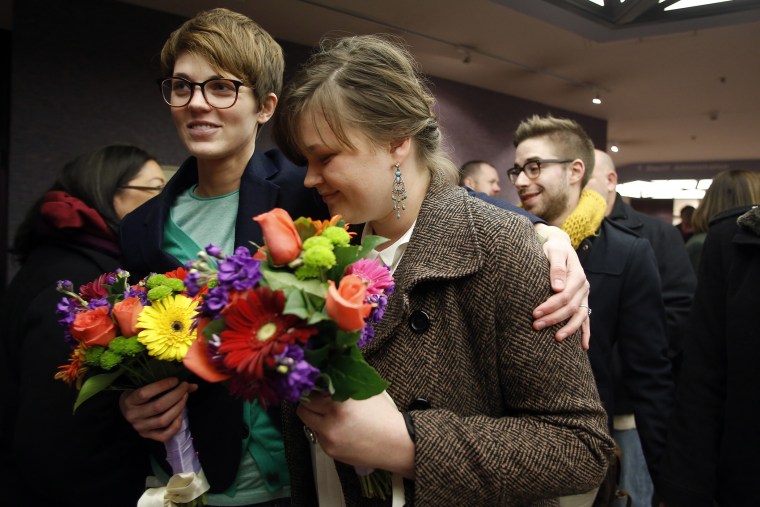 Natalie Dicou and her partner Nicole Christensen wait to get married at the Salt Lake County Clerks office, Dec. 20, 2013.