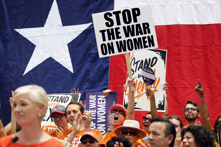Protesters rally before the start of a special session of the Legislature in Austin, July 1, 2013.