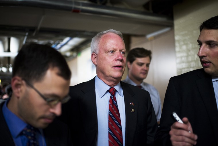 Rep. Paul Broun speaks with reporters as he leaves the House Republican Conference, Sept. 26, 2013.