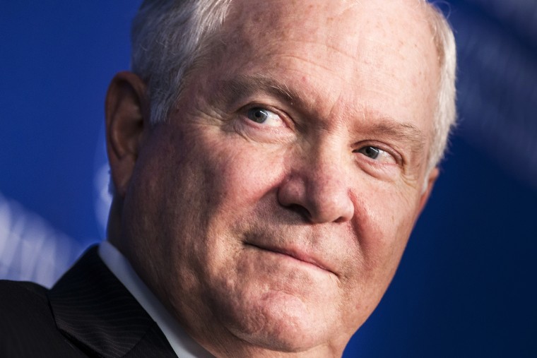 Former US Defense Secretary Robert Gates listens during a forum discussion at the Johns Hopkins University, Oct. 22, 2013.
