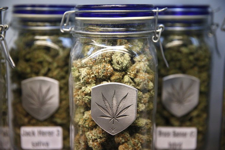 Different strains of pot are displayed for sale at Medicine Man marijuana dispensary in Denver, Friday Dec. 27, 2013.