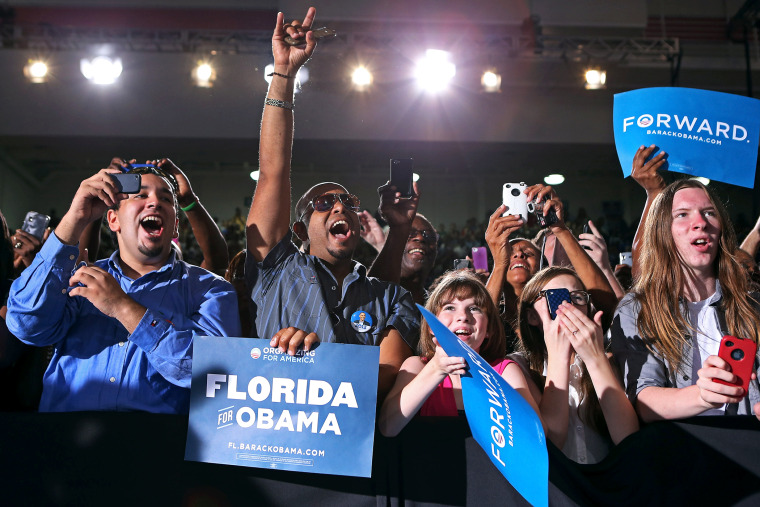 Supporters cheer for U.S. President Barack Obama at a campaign rally, Sept, 8, 2012.