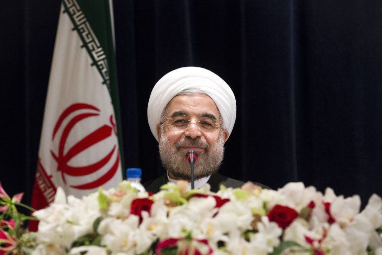 Iranian President Hassan Rouhani smiles at the end of a press conference, Sept. 27, 2013, in New York, N.Y.