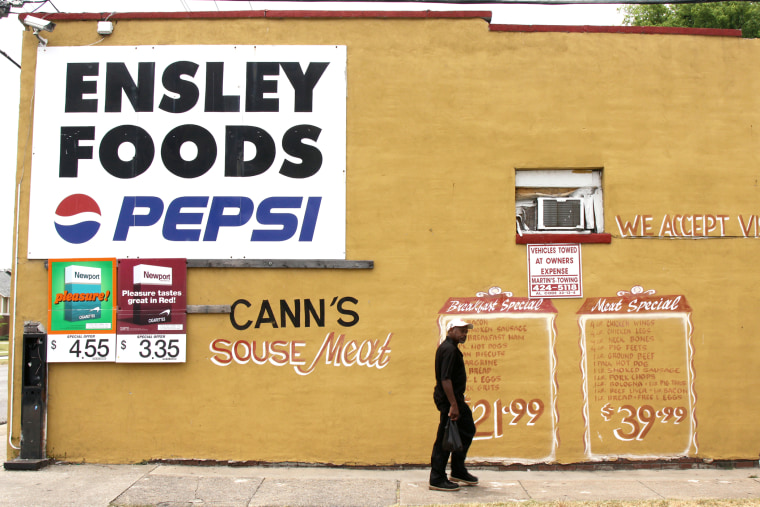 A man walks past a grocery store in Birmingham, Ala. on June 6, 2013