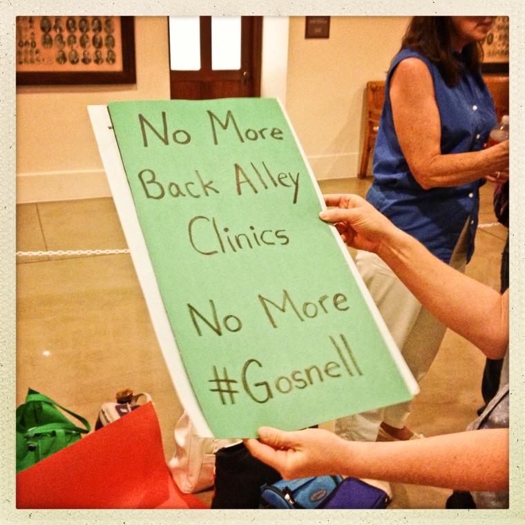 A pro-choice supporter inside the Texas state capitol to rally for and against the \"Texas Abortion Bill\" in Austin, Texas, on July 12, 2013.
