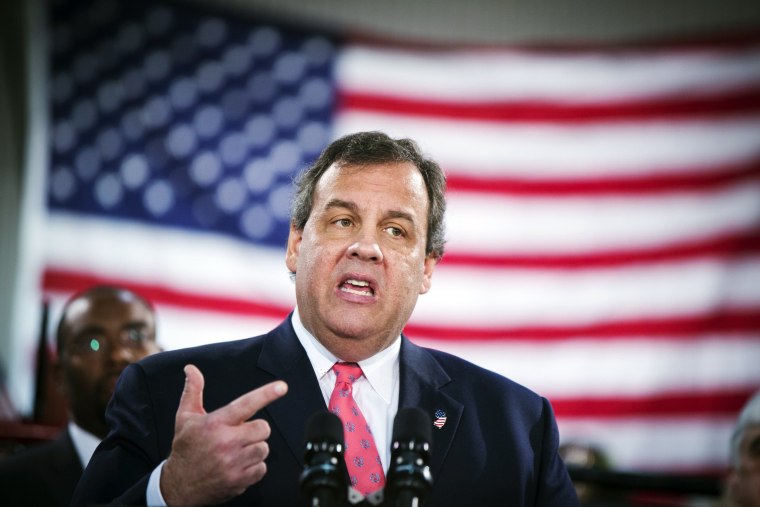 New Jersey Governor Chris Christie gestures as he speaks to media and homeowners in Manahawkin, New Jersey, January 16, 2014.