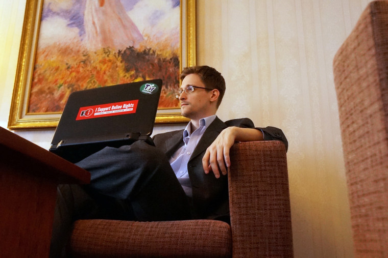 Former intelligence contractor Edward Snowden poses for a photo during an interview in Moscow, Dec. 2013.
