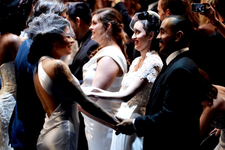 Same-sex couples exchange wedding vows as part of Macklemore and Ryan Lewis' performance at the Grammy's, Jan. 26, 2014.