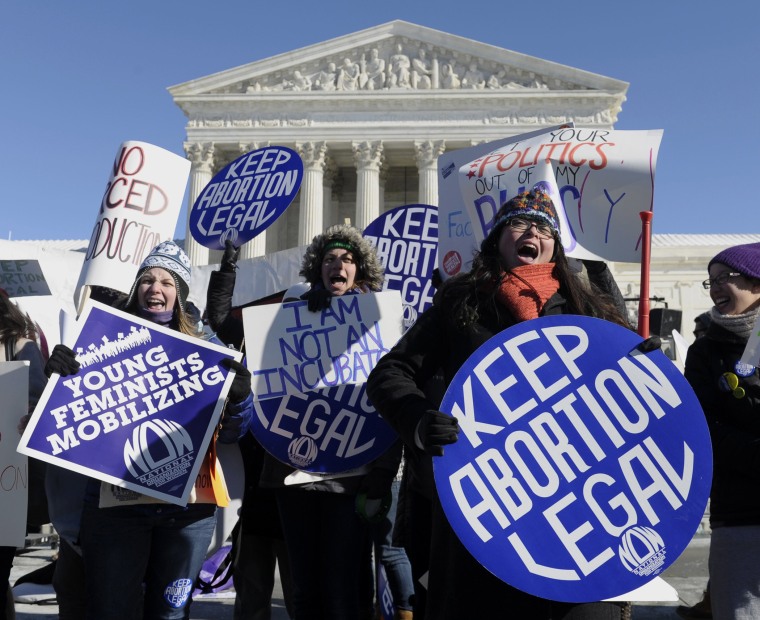 Pro-choice demonstrators rally outside the Supreme Court in Washington, Wednesday, January 22, 2014.