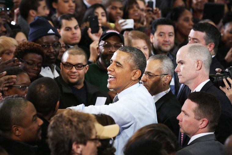 Barack Obama greets supporters, local politicians and store employees after delivering remarks in Lanham, Maryland, Jan. 29, 2014.