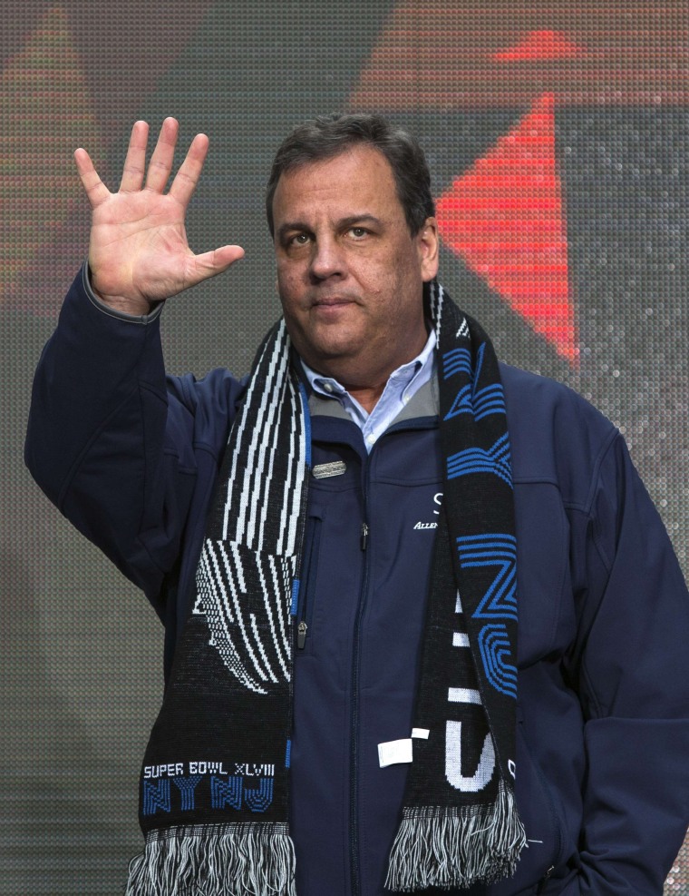 Image: New Jersey Governor Chris Christie arrives on stage during the Super Bowl Hand-Off Ceremony on Super Bowl Boulevard in Times Square as part of the Super Bowl lead up in New York