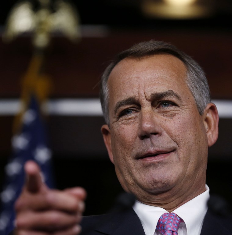 Image: House Speaker Boehner answers a question during his weekly news conference