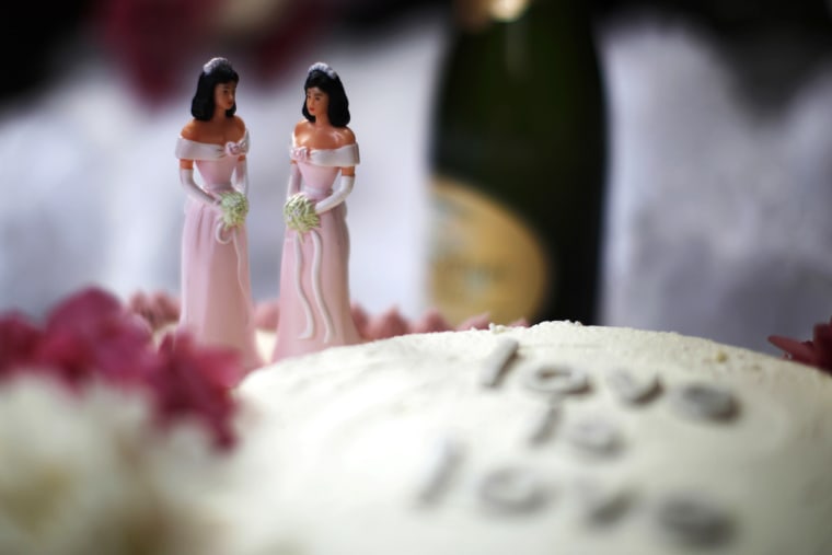 A wedding cake is seen at a reception for same-sex couples.