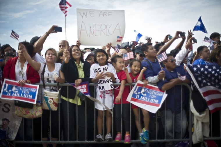 Immigration reform supporters cheer at a rally on the National Mall in Washington, Oct. 8, 2013.