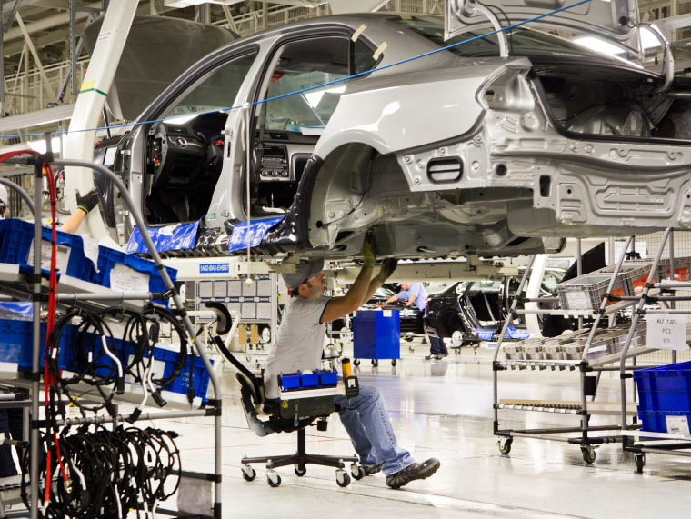 In this July 31, 2012, file photo, an employee works on a Passat sedan at the Volkswagen plant in Chattanooga, Tenn.