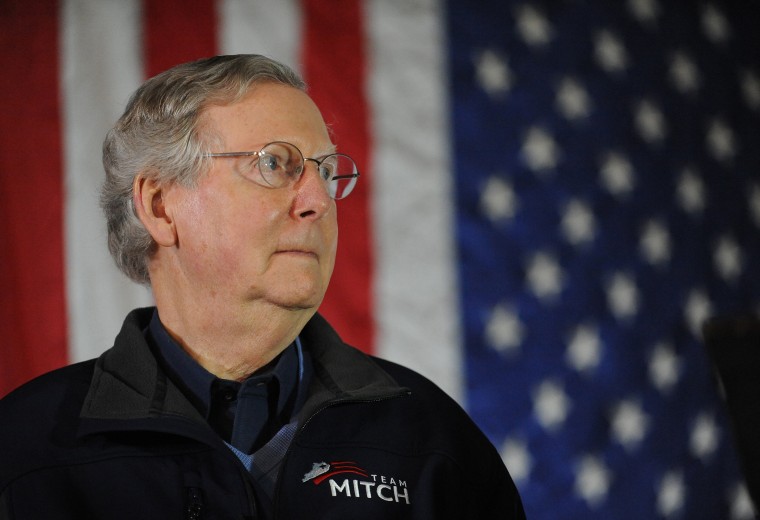 Sen. Mitch McConnell, R-Ky., waits to speak during a campaign stop at Badgett Supply in Madisonville, Ky., Saturday, Feb. 8, 2014.