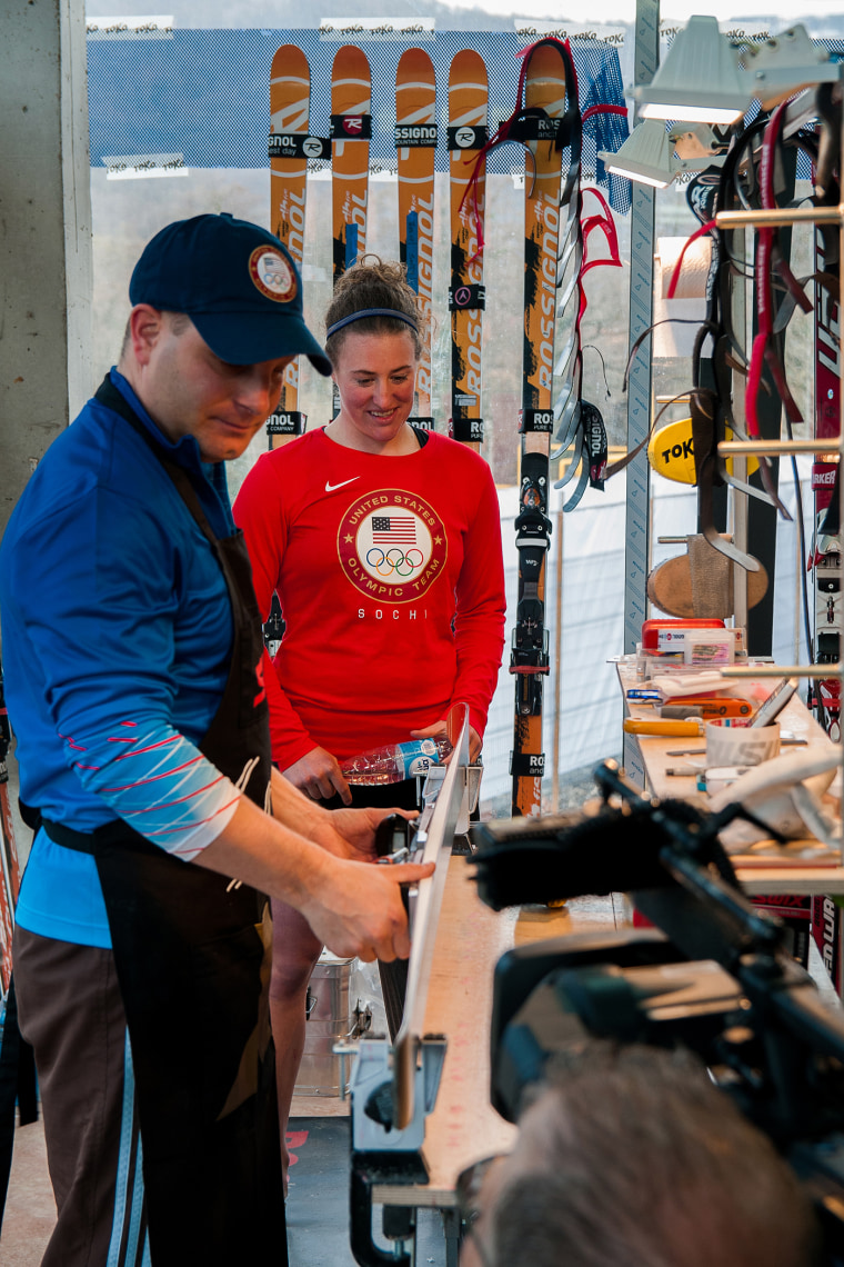 Olympic skier Stacey Cook talks with Dolinar in his workshop.