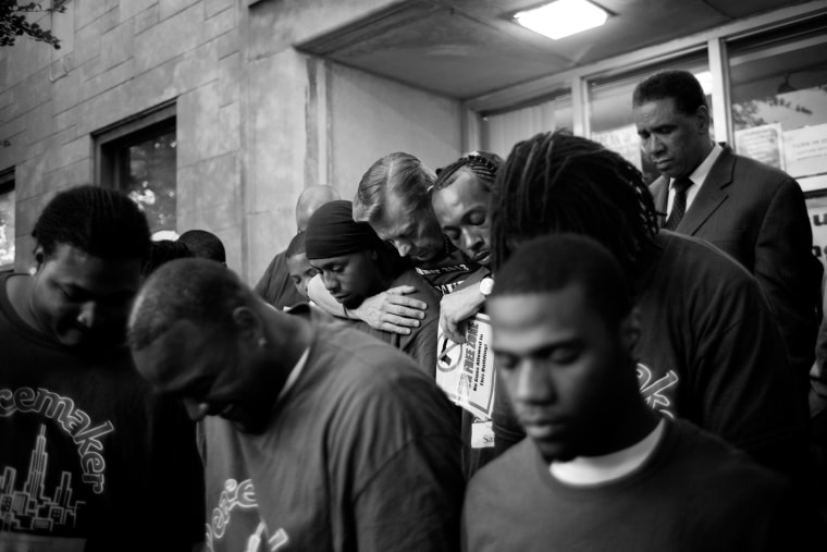 Members of St. Sabina Church gather to pray after a peace march in the Auburn Gresham neighborhood of Chicago.