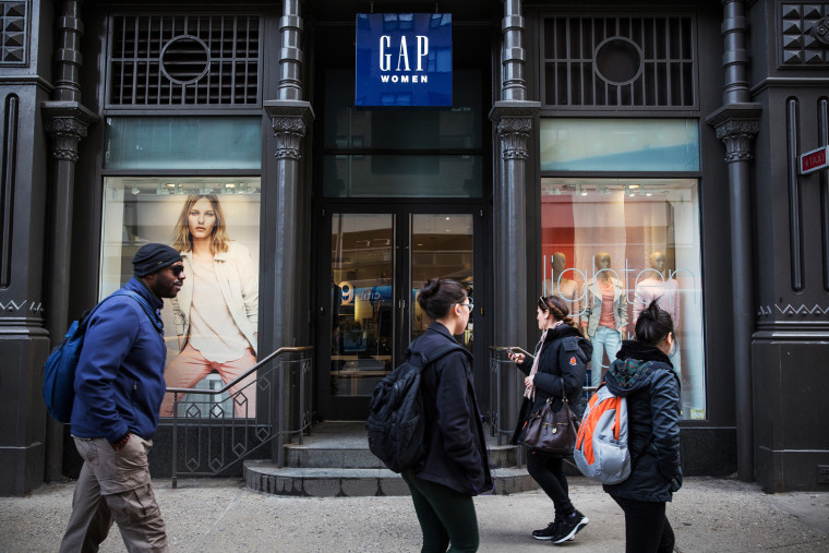 People walk past a Gap store in New York City, Feb. 20, 2014.
