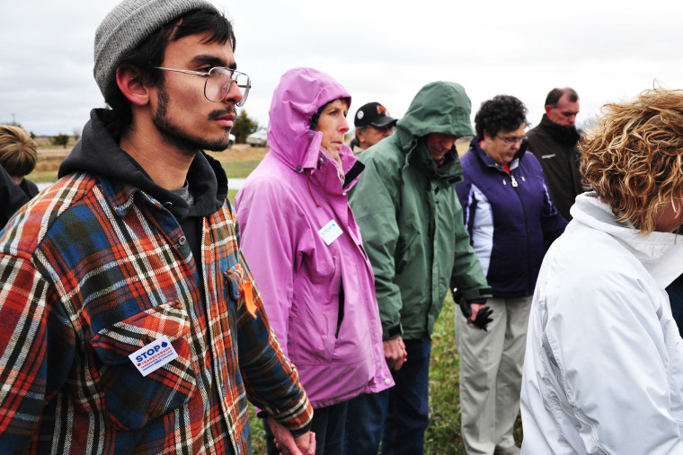 People opposed to the Keystone XL pipeline gather in prayer in Fullerton, Nebraska, April 17, 2013.