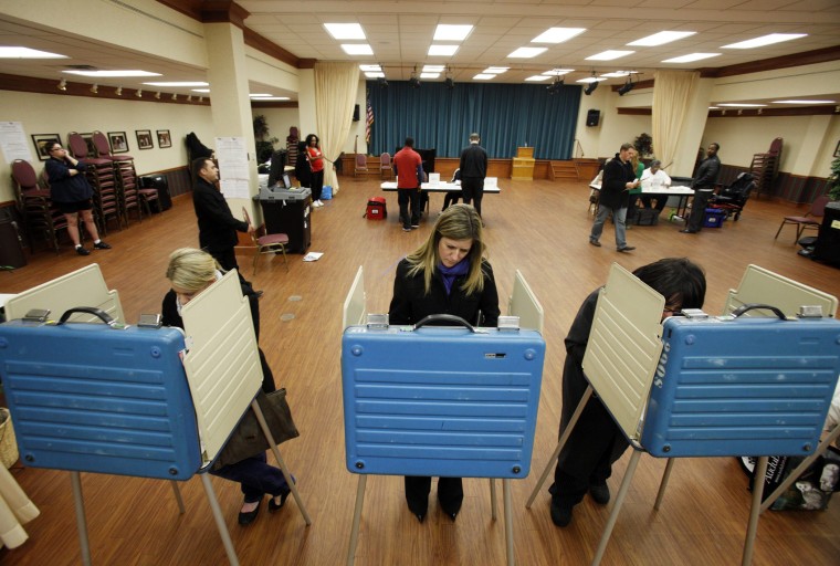 Voters cast their ballots at a polling site in the 2012 US presidential election in Cleveland, Ohio, November 6, 2012.