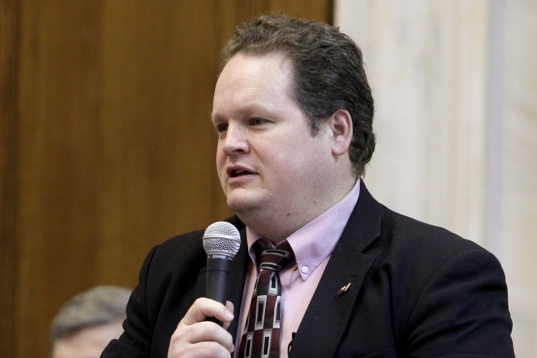 Arkansas State Rep. Nate Bell, R-Mena, speaks from his desk in the House chamber at the Arkansas state Capitol, April 19, 2013, in Little Rock, Ark.