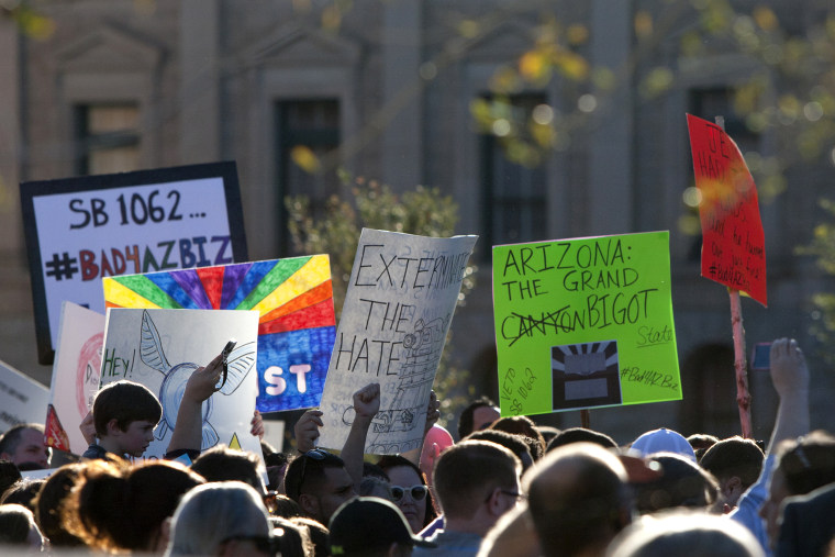 Opponents of the SB1062, a religious freedom bill, urged Gov. Brewer to veto the bill during a protest rally at the state Capitol, Feb. 21, 2014.