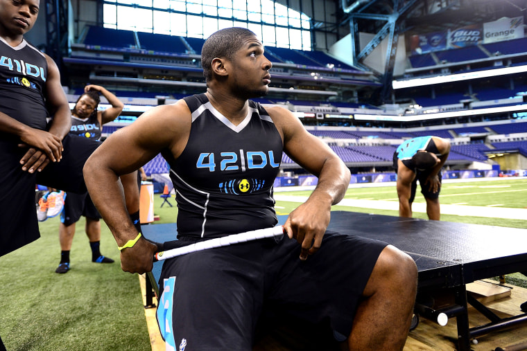 Michael Sam warms up at the 2014 NFL Scouting Combine at Lucas Oil Stadium in Indianapolis, on Feb. 24, 2014.
