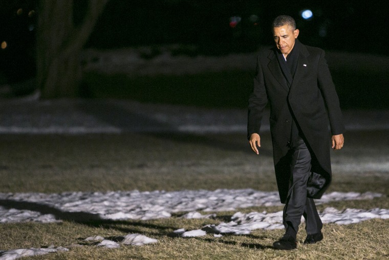 U.S. President Barack Obama walks across the South Lawn of the White House on February 17, 2014.