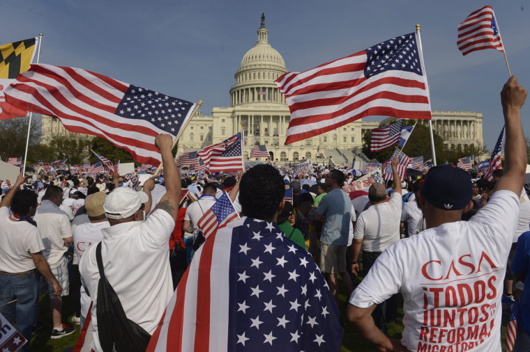 People show their support during a rally for comprehensive immigration reform on the West Front of the U.S. Capitol in Washington D.C., April 10, 2013.