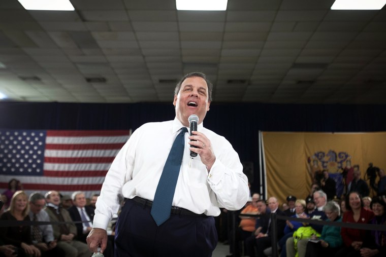 Chris Christie laughs as he takes a question during a town hall meeting in Sterling, N.J., Feb. 26, 2014.