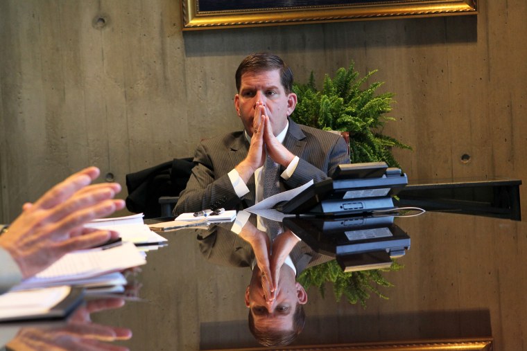 Mayor Marty Walsh listens to Paul Curran and Dave Sussick from the office of Labor Relations, during a meeting in his office, Jan. 28, 2014.