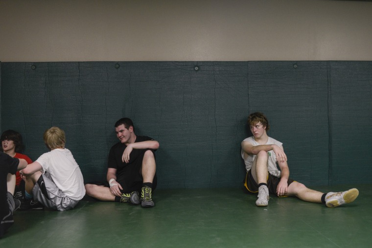 Mike Sisco, (center), a 17-year-old Choctaw at wrestling practice. Sisco a husband and father of a 2-year-old boy. The teen pregnancy rate in the Choctaw Nation is double the national average.
