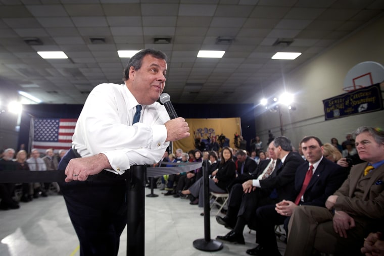 New Jersey Governor Chris Christie listens to a question as he leans on a pole during a town hall meeting in Sterling, N.J. on Feb. 26, 2014.