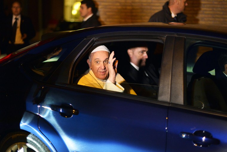 Pope Francis waves as he leaves the Santa Sabina church in Rome, March 5, 2014.