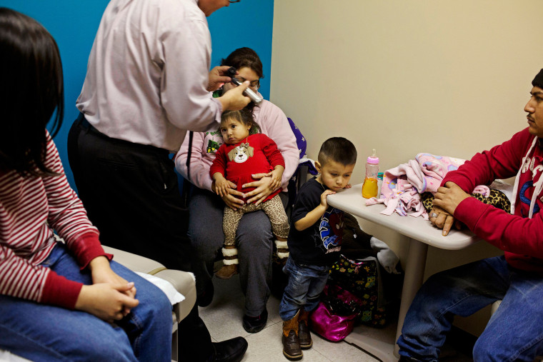 Dr. Gary Bevill meets with patients at SAMA Health Care, in El Dorado, Ark.