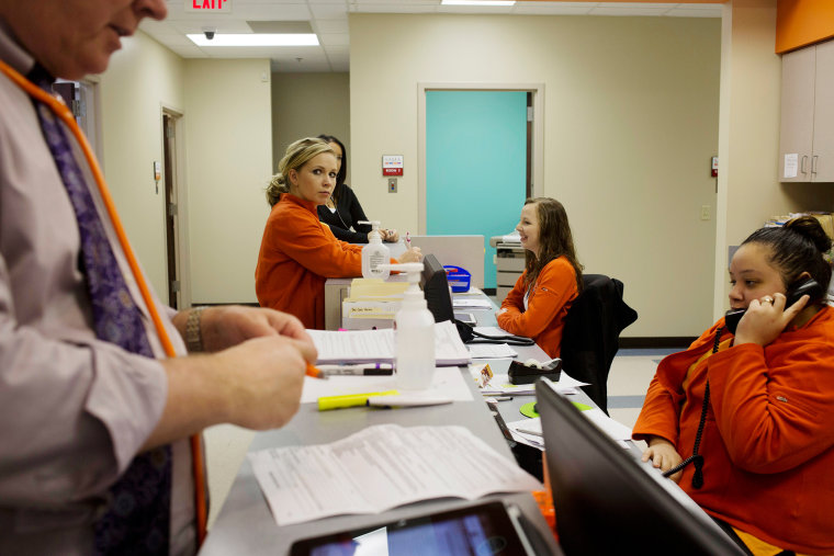 The orange team at SAMA Health Care, in El Dorado, Ark.