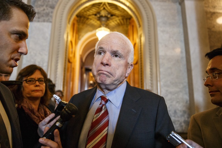 Sen. John McCain leaves the Senate chamber, March 5, 2014.