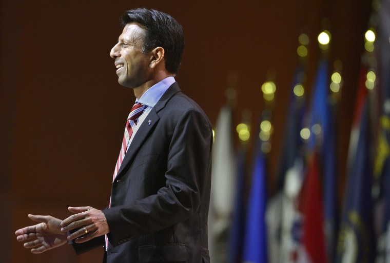 Louisiana Gov. Bobby Jindal greets guests as he arrives to address the Conservative Political Action Conference (CPAC) in Oxon Hill, Maryland, March 6, 2014.