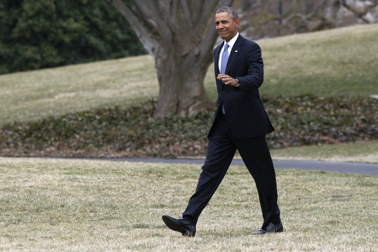 President Barack Obama walks on the South Lawn of the White House in Washington, on March 11, 2014.