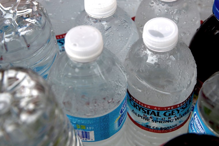 Bottles of water sit in a cooler at a hot dog stand on March 5, 2014 in San Francisco, California.