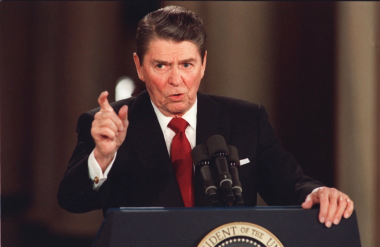 In this March 19, 1987 file photo, President Reagan gestures during a news conference at the White House in Washington.