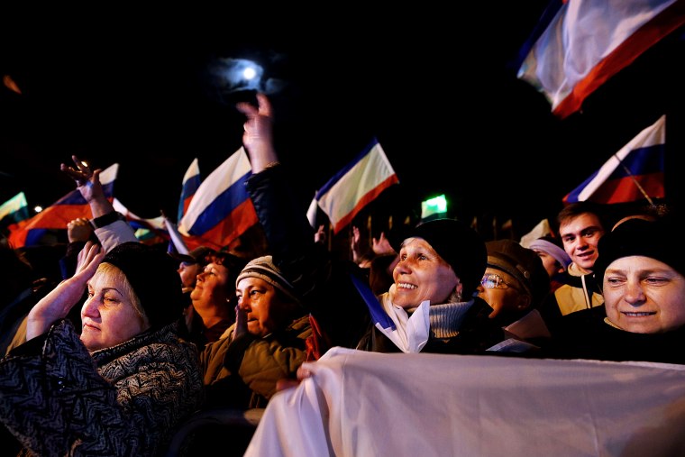 Pro-Russian supporters attend a rally in Lenin Square after a day of voting on March 16, 2014 in Simferopol, Ukraine.