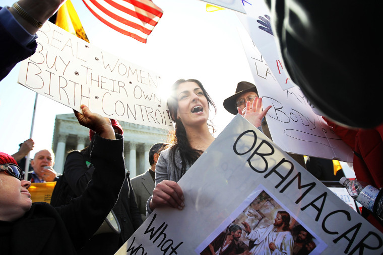 Protesters gather in front of the U.S. Supreme Court in advance of oral arguments on the Patient Protection and Affordable Care Act, March 27, 2012.