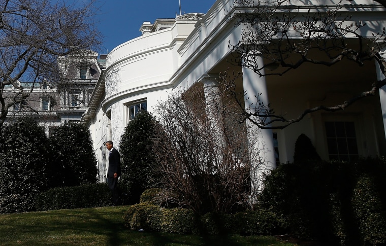 President Barack Obama walks from the Oval Office of the White House to deliver a statement, March 20, 2014.