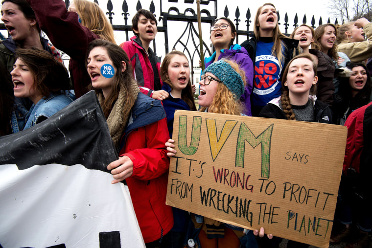 Students protesting against the proposed Keystone XL pipeline chant slogans in front of the White House, March 2, 2014 in Washington, DC.