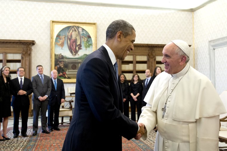 Pope Francis (R) and US President Barack Obama shake hands during a private audience on March 27, 2014 at the Vatican.