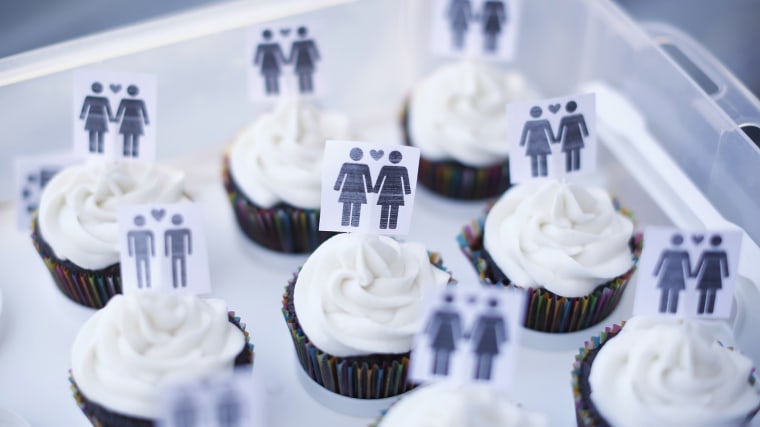 A box of cupcakes are seen topped with icons of same-sex couples at City Hall in San Francisco, June 29, 2013.